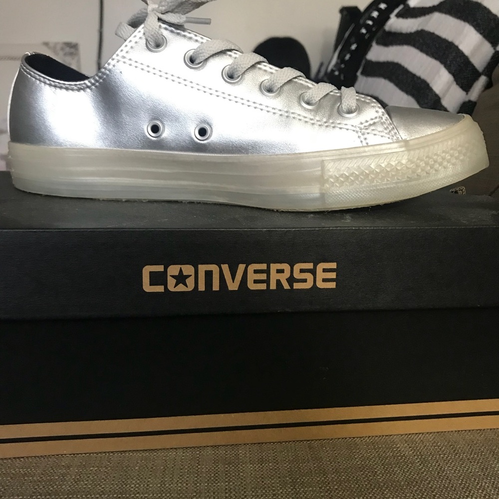 Woman’s metallic Converse Chuck Taylors